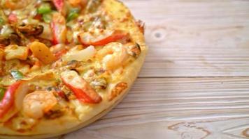 seafood shrimps, octopus, mussel and crab pizza on wood tray video