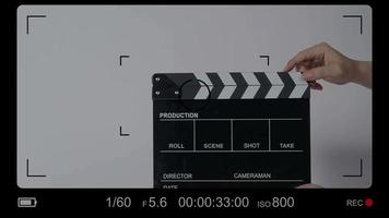 Clapper board. Close up hand and film making clapperboard isolated on background
