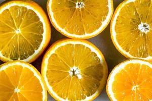 Orange slice background for summer. Background with Citrus-fruit Of Orange Slices. Juicy Slice of Orange