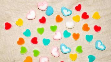 Heart Colorful sweets. Lollipops and candies. Top view background love abstract valentine. photo