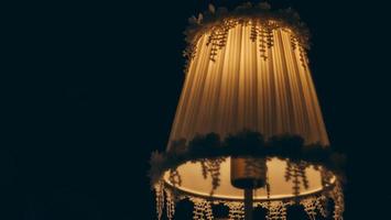 Vintage table lamp illuminated, Elegant Chandelier illuminated interior decoration in five star hotel or luxury house photo