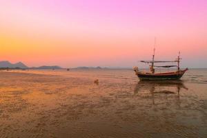 .beautiful seascape landscape sea beach mountain with boat  silhouette photography at sunset pastel colorful sky nature background photo