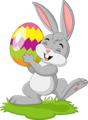 Cartoon little rabbit holding easter egg in the grass