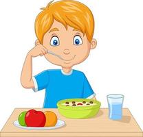 Cartoon little boy having breakfast cereals with fruits