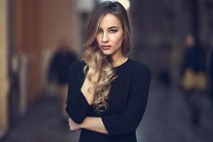 Beautiful blonde russian woman in urban background photo