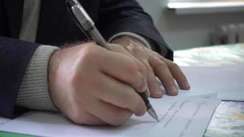 Hand Of A Business Man handle Text Documents With Pen 4K video