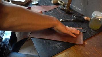 Leather Factory Manufacture Handmade Notebook - close up Hands work
