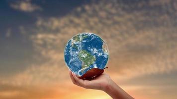 hand holding the earth , ecology earth day. video