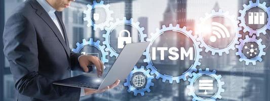 ITSM. Businessman pressing virtual screen IT Service Management. Concept for information technology service management photo
