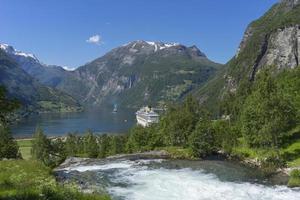 Cruise ship at Geiranger fjord in Norway photo