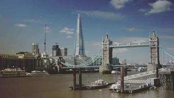 London skyline on Thames river with Shard in the background and Tower Bridge, time lapse
