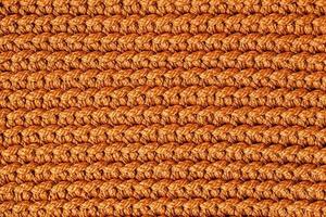 Orange knitted fabric texture background