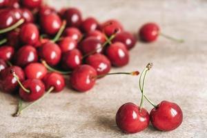 Fresh ripe cherries on wooden background. Copy, empty space for text photo