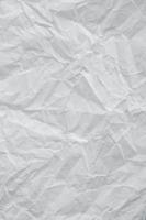 Crumpled white paper texture as a background image. Paper for design with copy space for text or image. Top view. Copy, empty space for text photo