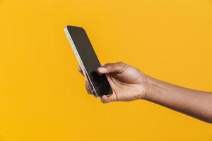 African woman holding phone in her hand photo