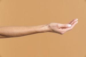 Woman holding palm up photo