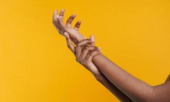 African woman holding her own hand photo