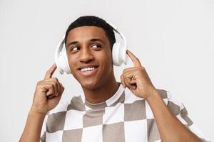Portrait of happy African man looking to the side with headphones photo