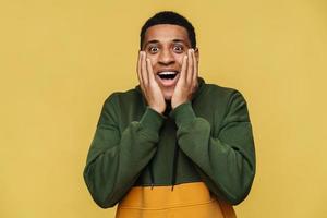 Portrait of surprised African man in hoodie looking at the camera photo