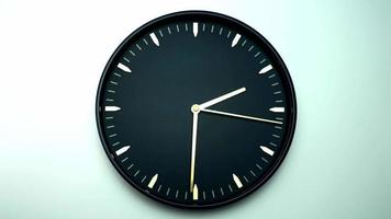 Black wall clock showing the time 2 p. m. Time walks slowly in a day on white background. video