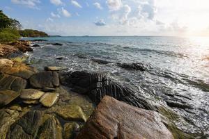 Amazing tropical beach rocky coast sea ocean paradise landscape sunrise or sunset sea blue sky photo