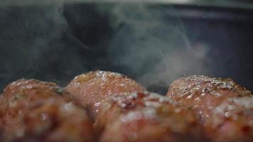 Tasty Meatballs Frying on Hot Pan Close Up Shot.