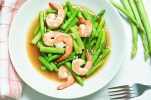 Asparagus Shrimp Seafood Cooked Health Food - Stir fried shrimps with asparagus green on white plate
