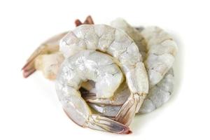 Fresh raw shrimps prawns isolated on white background - Peel shrimp seafood photo