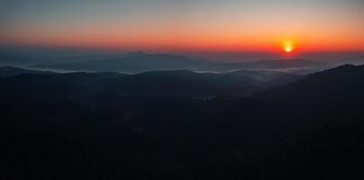 early morning sunrise in the forest photo