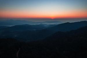 early morning sunrise in the forest photo