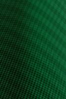 Green textured background with light effect dark abstract pattern. photo