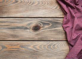 Checkered napkin on a wooden background photo