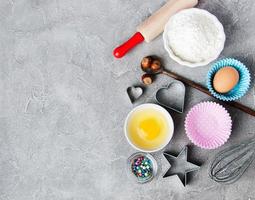 Top view of  kitchen table with baking ingredients photo