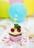 Cupcake with a numeral seven candle photo