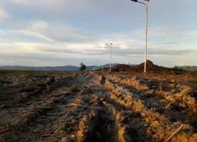 a broken country road. muddy road. photo