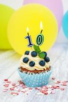 Cupcake with a numeral ten candle photo