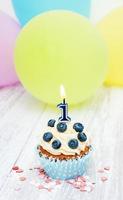 Cupcake with a numeral one candle photo