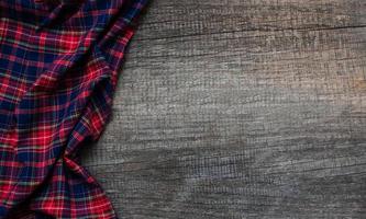 Checkered napkin on a wooden background photo