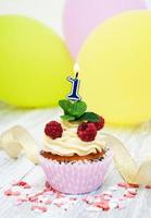 Cupcake with a numeral one candle photo