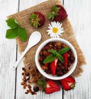 Homemade granola with strawberries photo