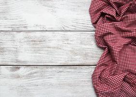 Checkered napkin on a wooden background photo