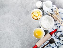 Top view of  kitchen table with baking ingredients photo