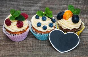 Cupcakes with fresh berries photo