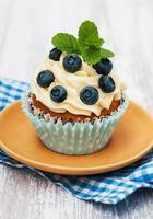 Cupcake with fresh blueberries photo