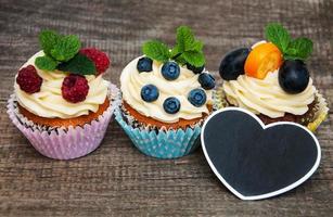 Cupcakes with fresh berries photo