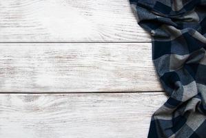 Checkered napkin on a wooden background photo