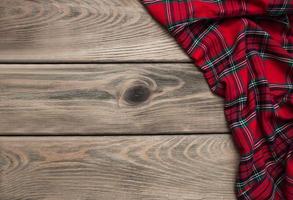 Checkered napkin on a wooden background photo