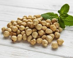 Peeled hazelnuts on a table photo