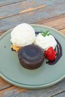 chocolate lava with vanilla ice-cream and whipping cream photo