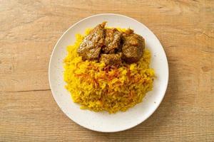 Beef Biryani or Curried rice and beef - Thai-Muslim version of Indian biryani, with fragrant yellow rice and beef photo